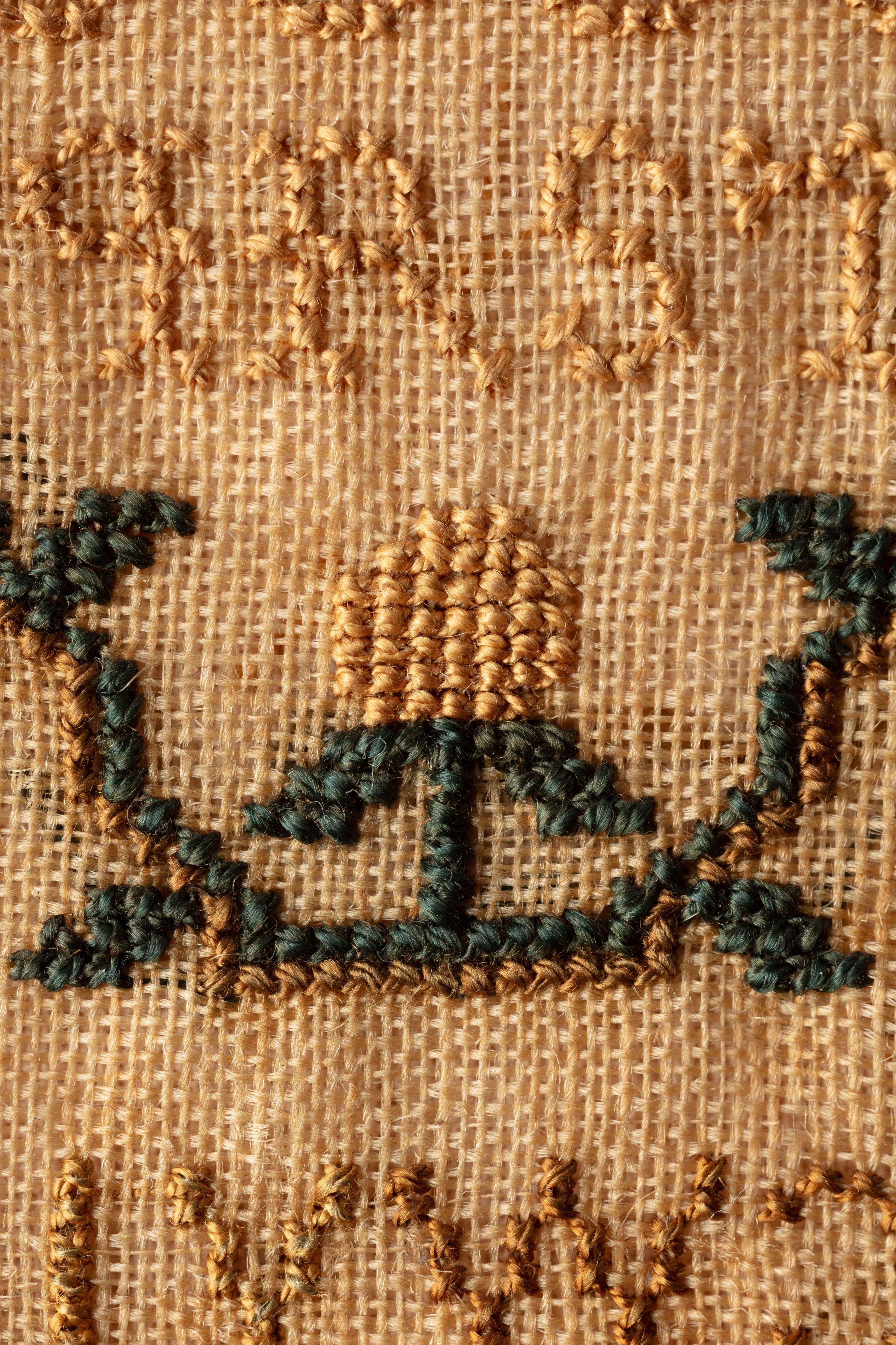 fine cloth, finely stitched sampler with texts, alphabets, numerals, and motifs.