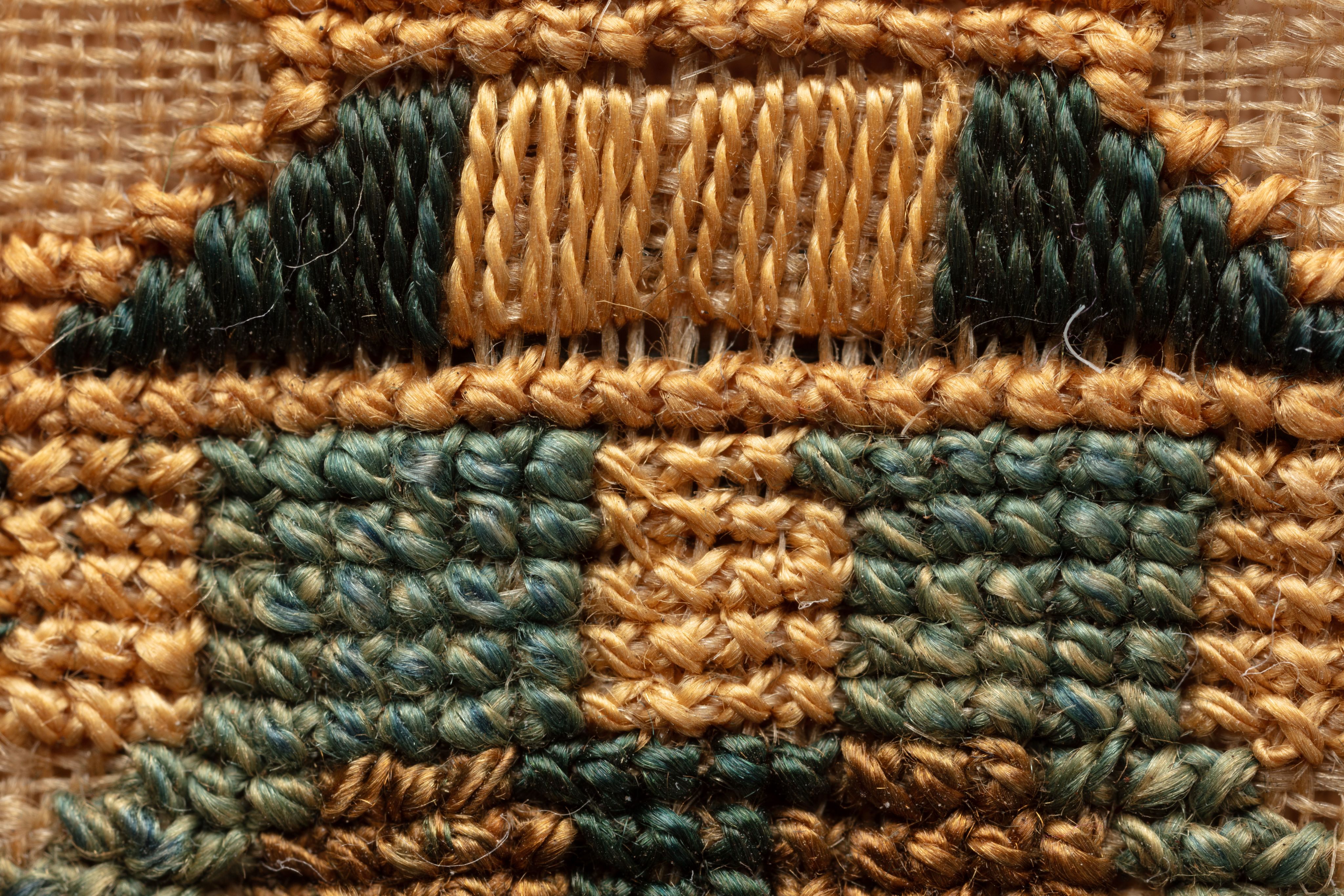 fine cloth, finely stitched sampler with texts, alphabets, numerals, and motifs.