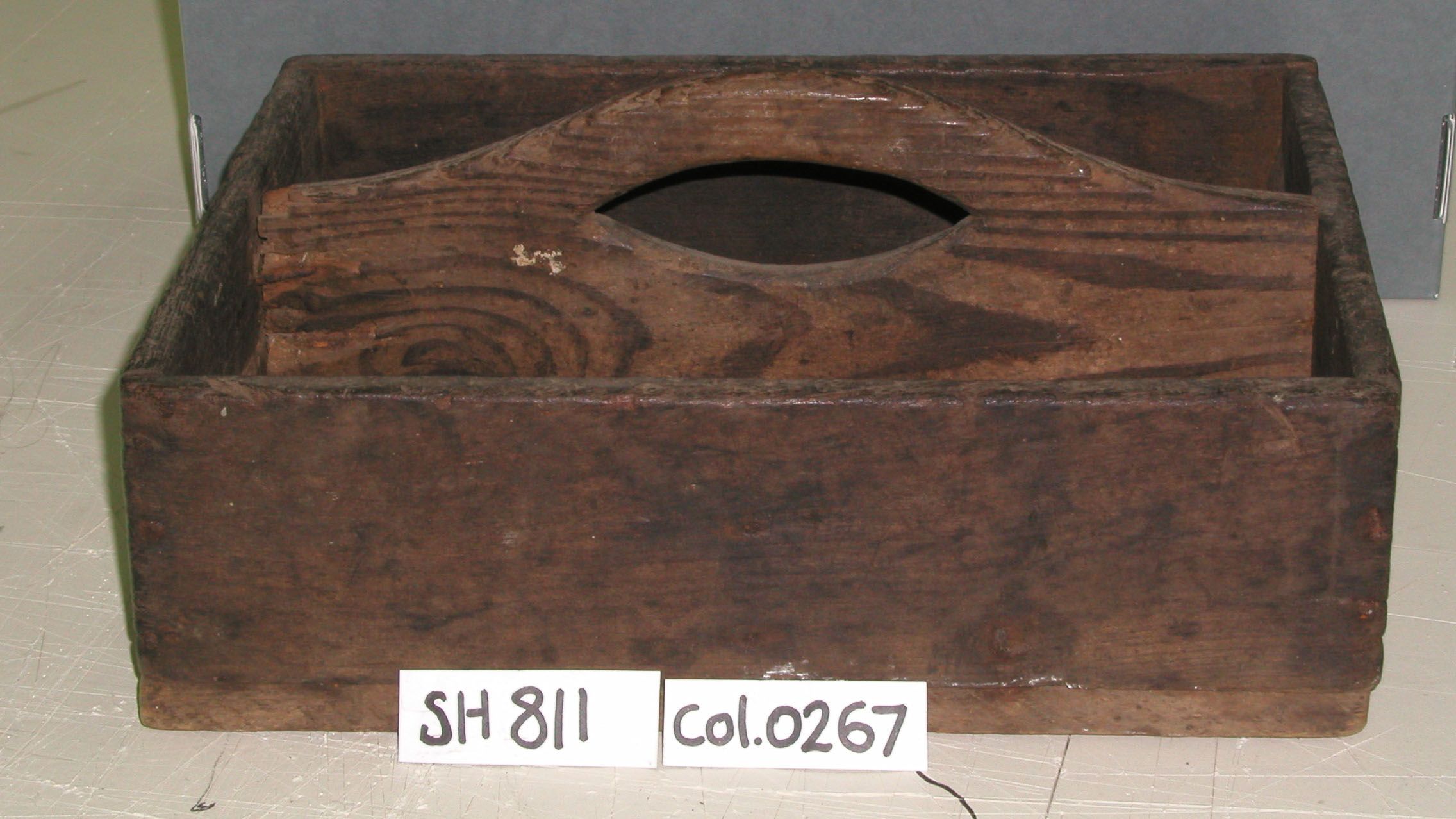 wooden tool box 13" L. 10 3/4" W. Made with two compartments 4 1/2" each. Handle cut out of dividing piece.