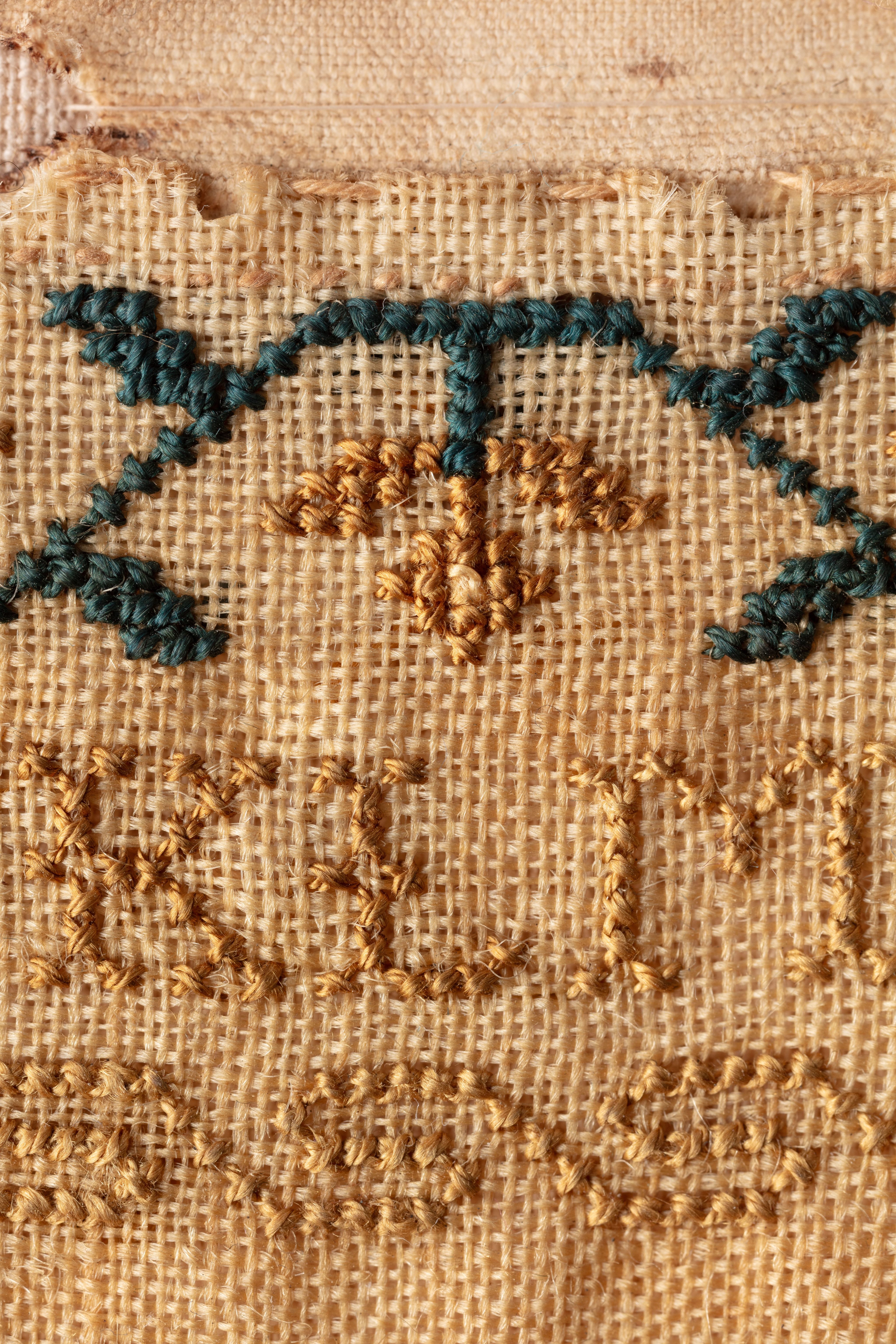 fine cloth, finely stitched sampler with texts, alphabets, numerals, and motifs.