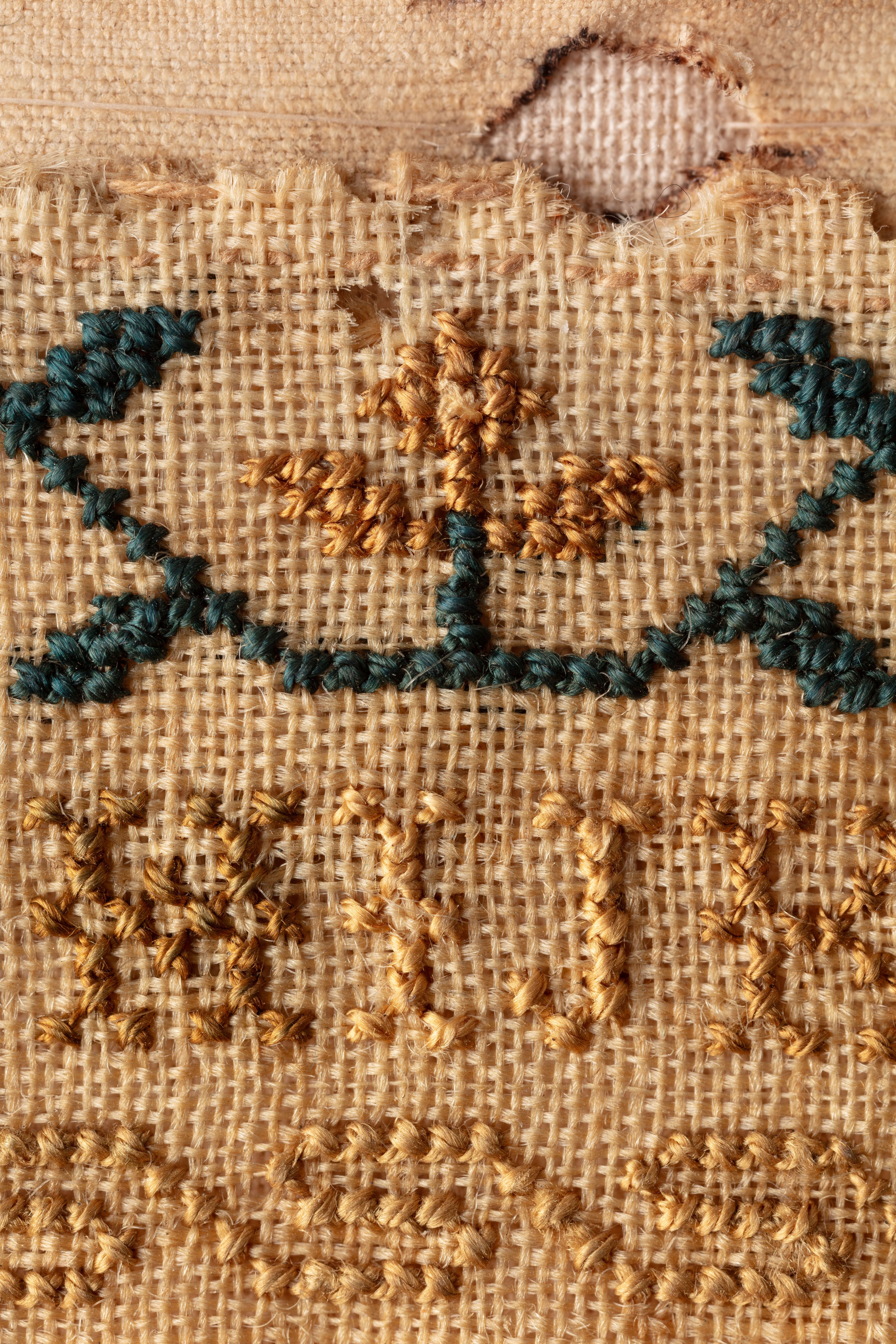 fine cloth, finely stitched sampler with texts, alphabets, numerals, and motifs.