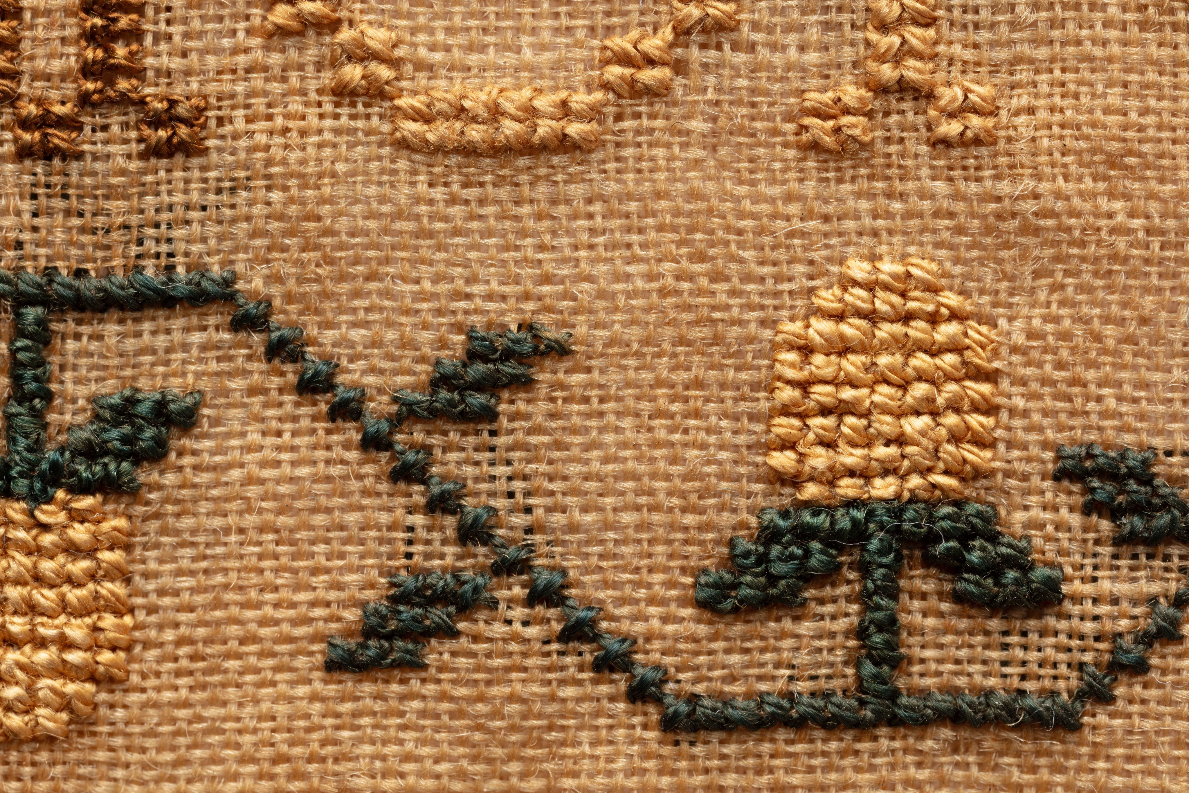 fine cloth, finely stitched sampler with texts, alphabets, numerals, and motifs.