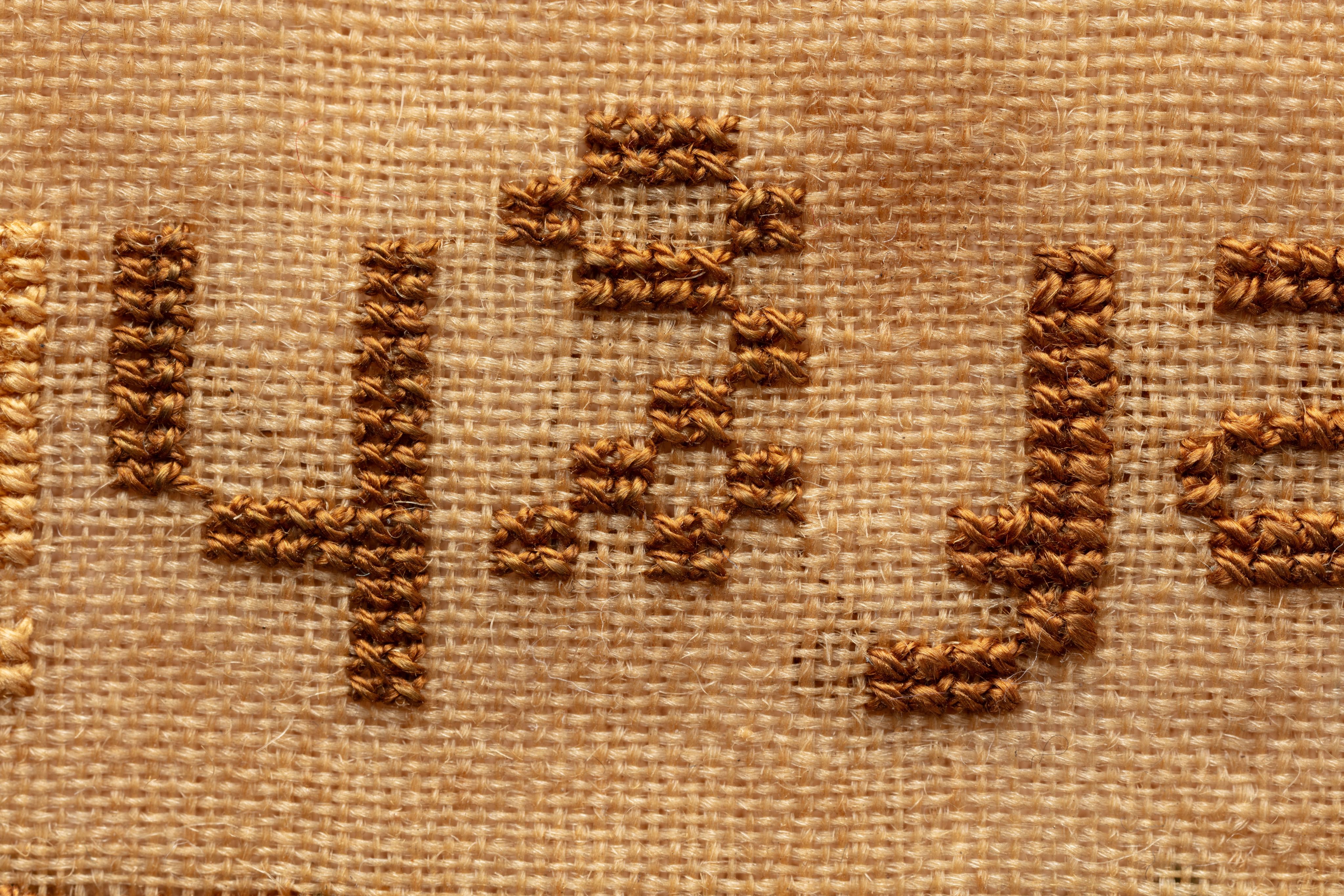 fine cloth, finely stitched sampler with texts, alphabets, numerals, and motifs.
