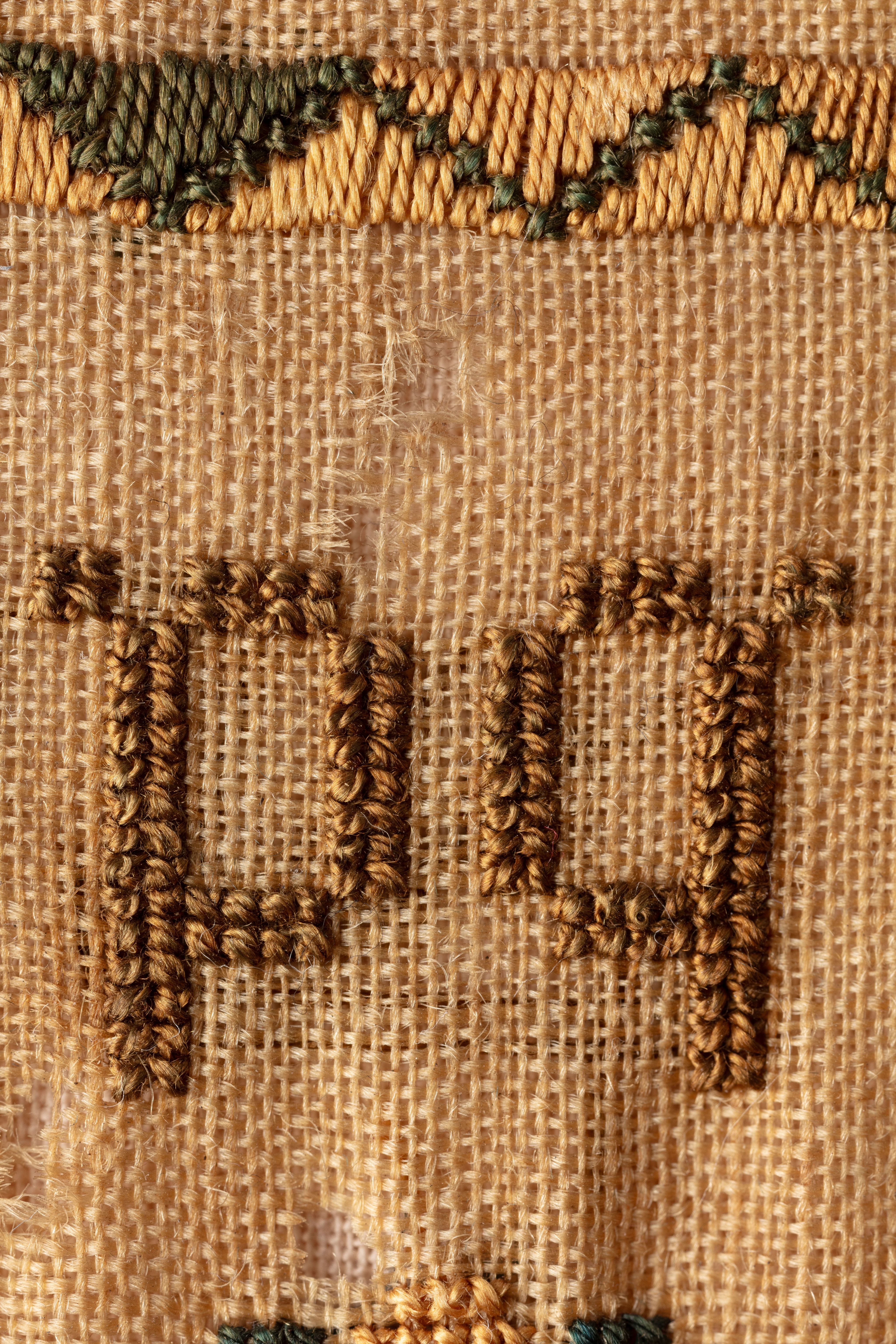 fine cloth, finely stitched sampler with texts, alphabets, numerals, and motifs.