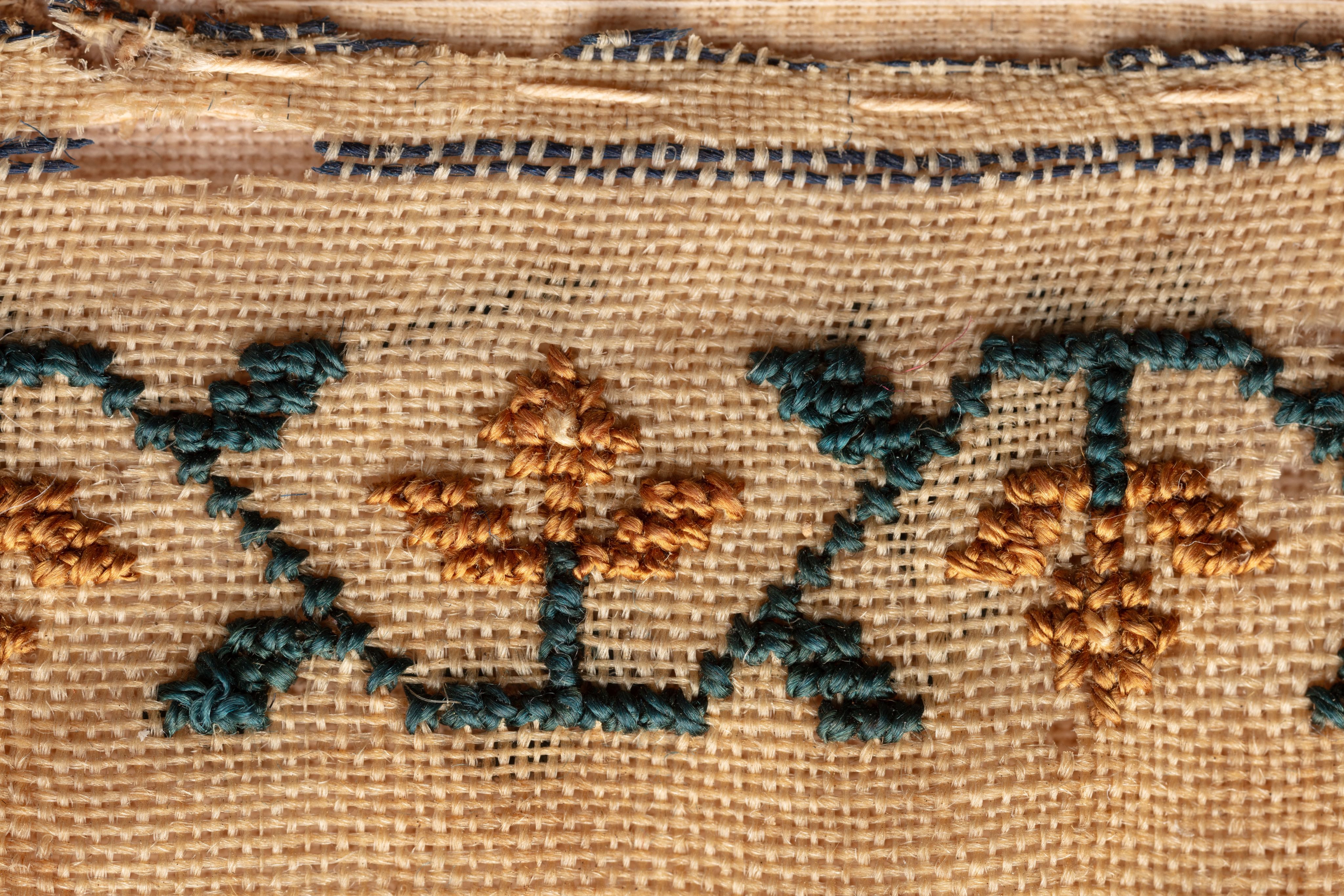 fine cloth, finely stitched sampler with texts, alphabets, numerals, and motifs.