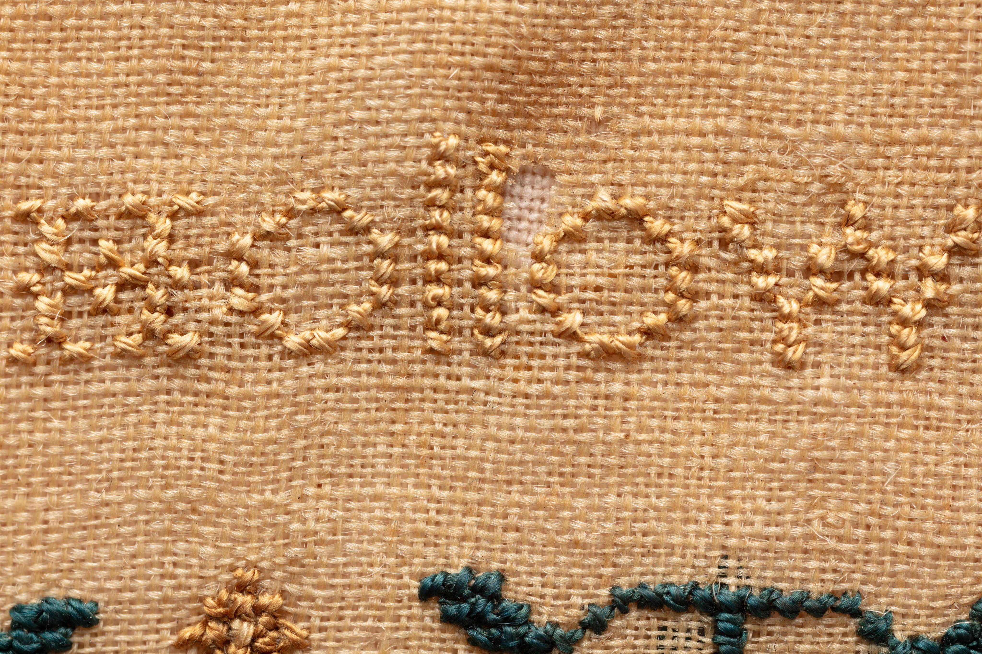 fine cloth, finely stitched sampler with texts, alphabets, numerals, and motifs.