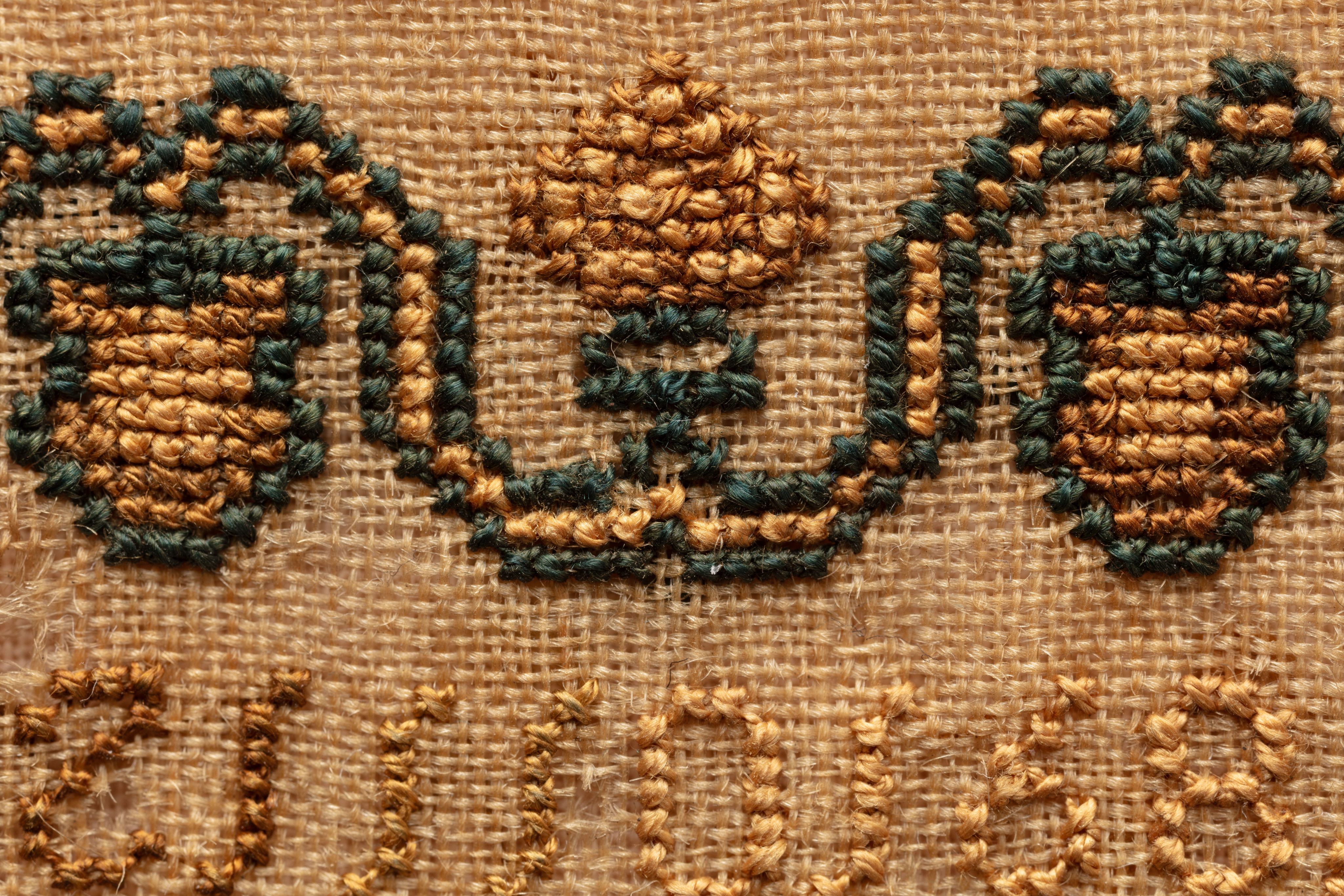 fine cloth, finely stitched sampler with texts, alphabets, numerals, and motifs.