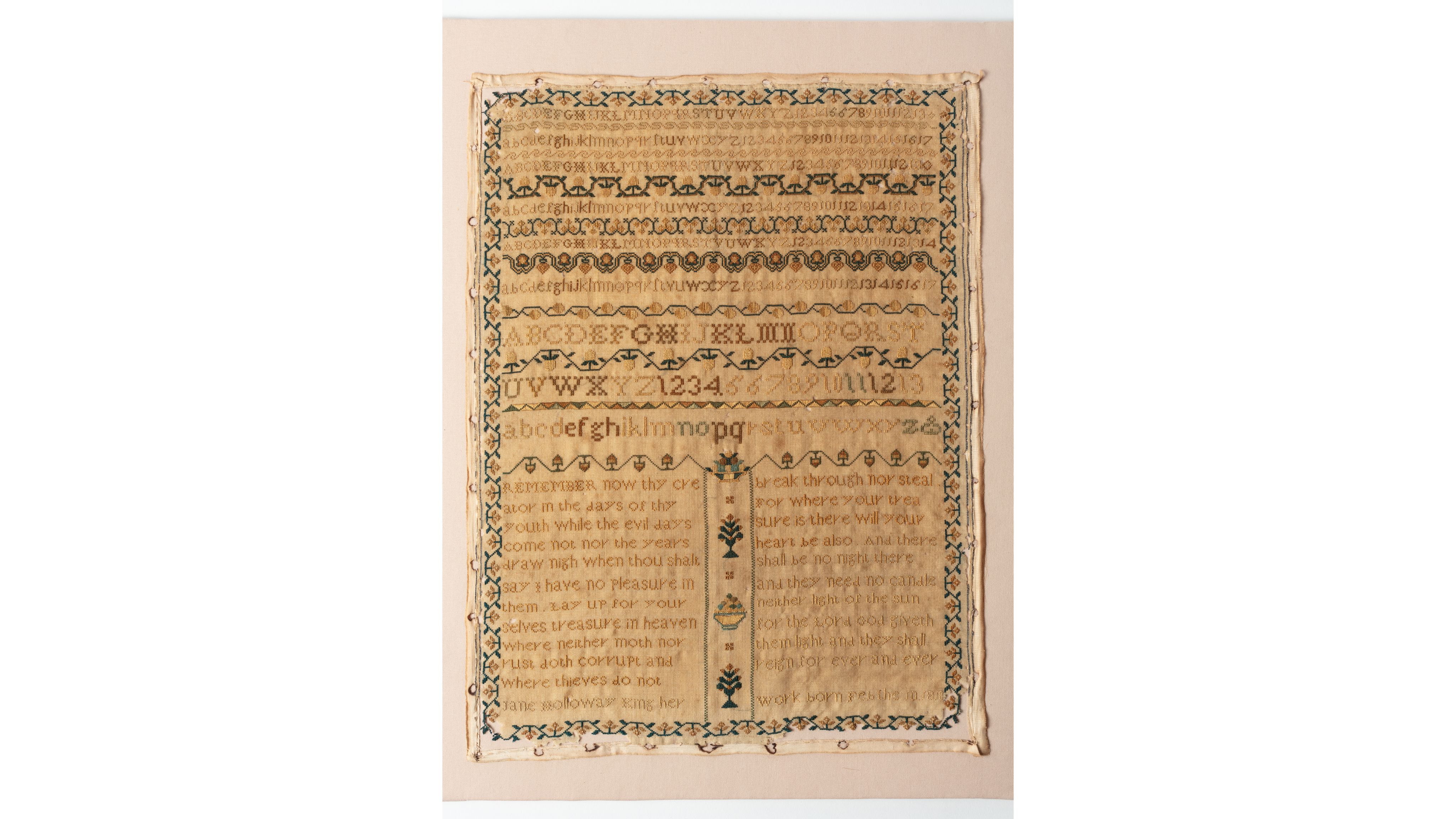 fine cloth, finely stitched sampler with texts, alphabets, numerals, and motifs.