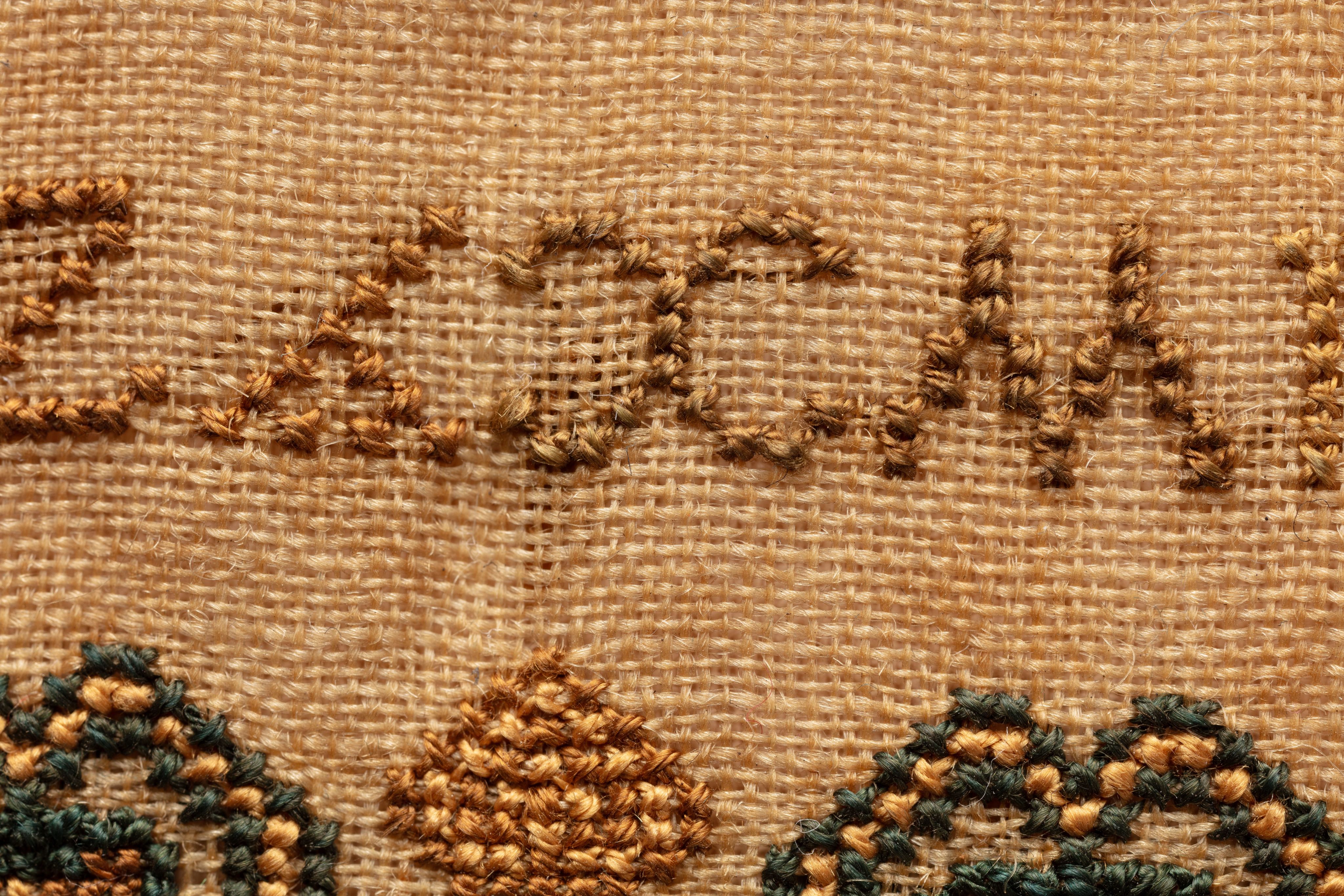 fine cloth, finely stitched sampler with texts, alphabets, numerals, and motifs.