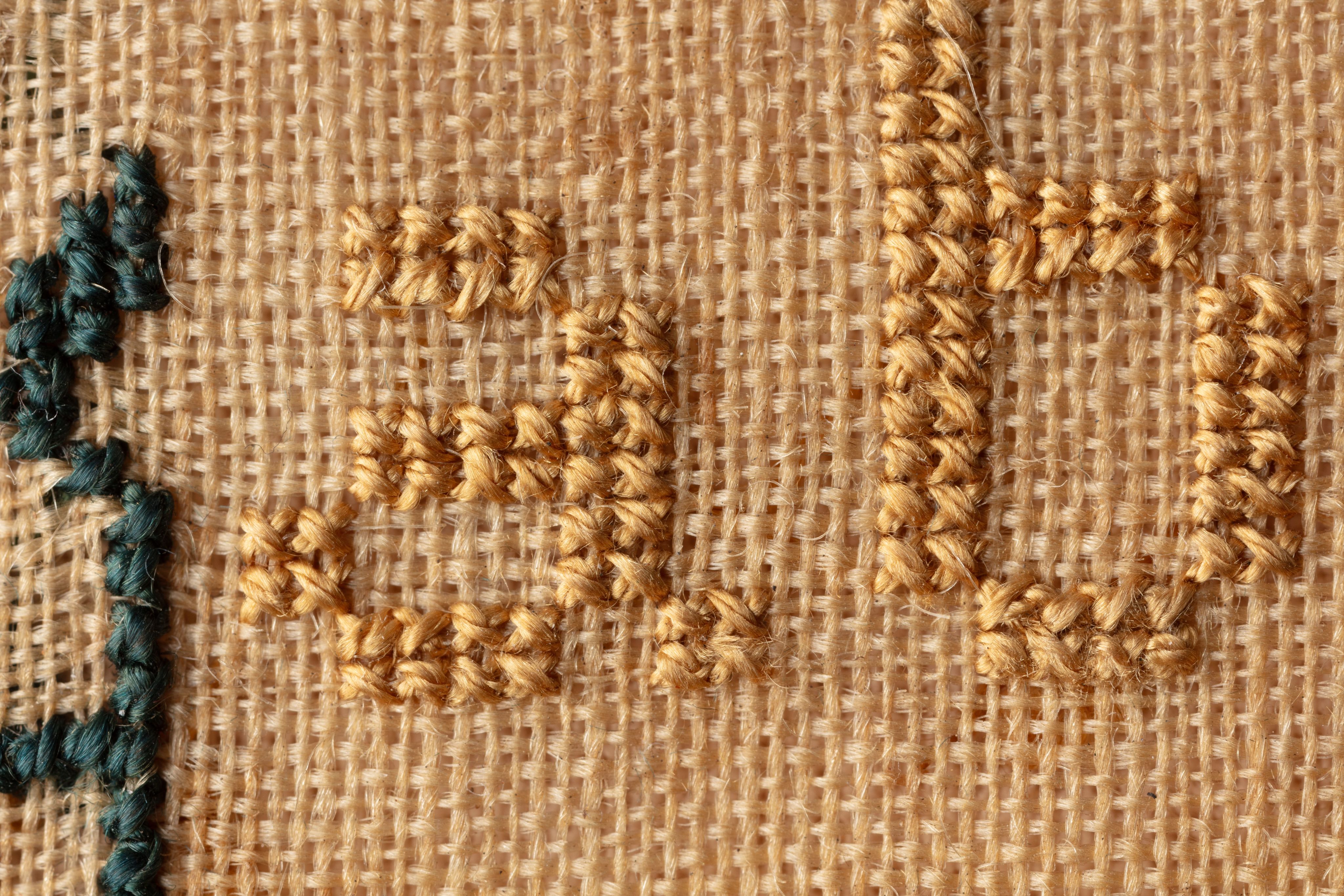 fine cloth, finely stitched sampler with texts, alphabets, numerals, and motifs.