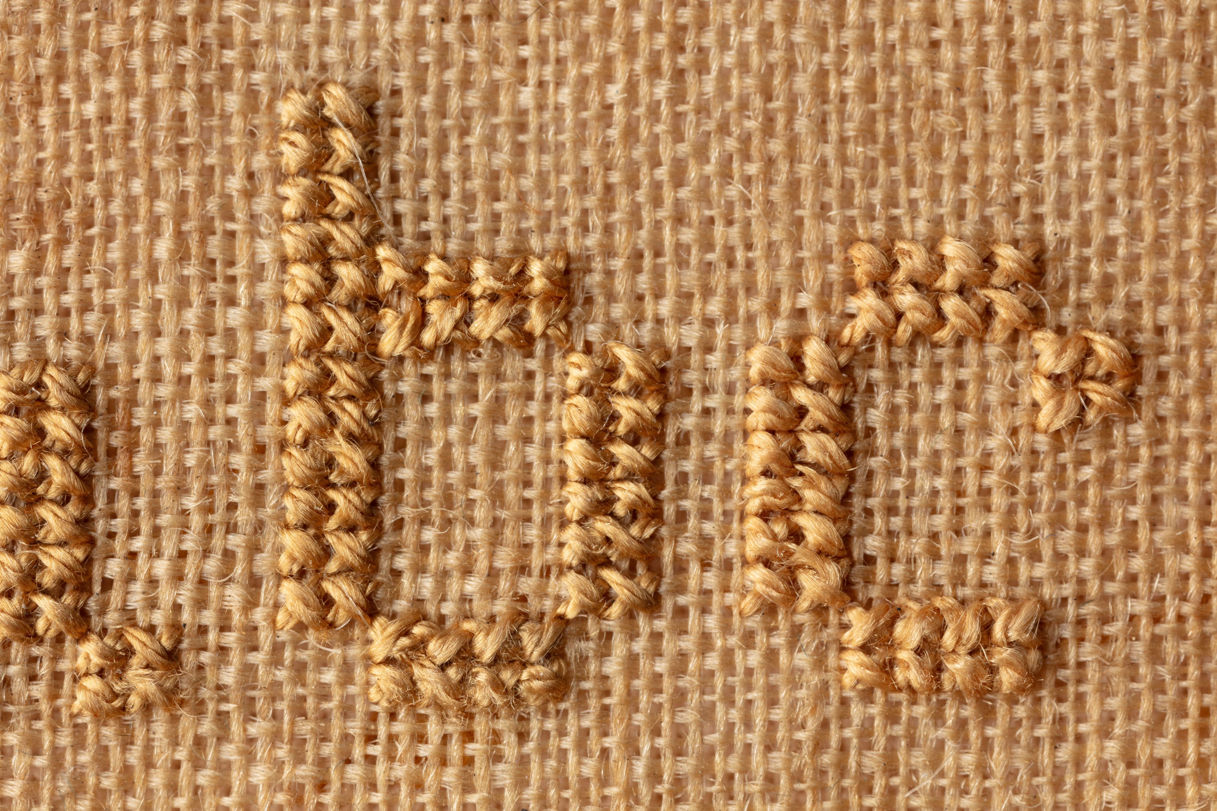 fine cloth, finely stitched sampler with texts, alphabets, numerals, and motifs.