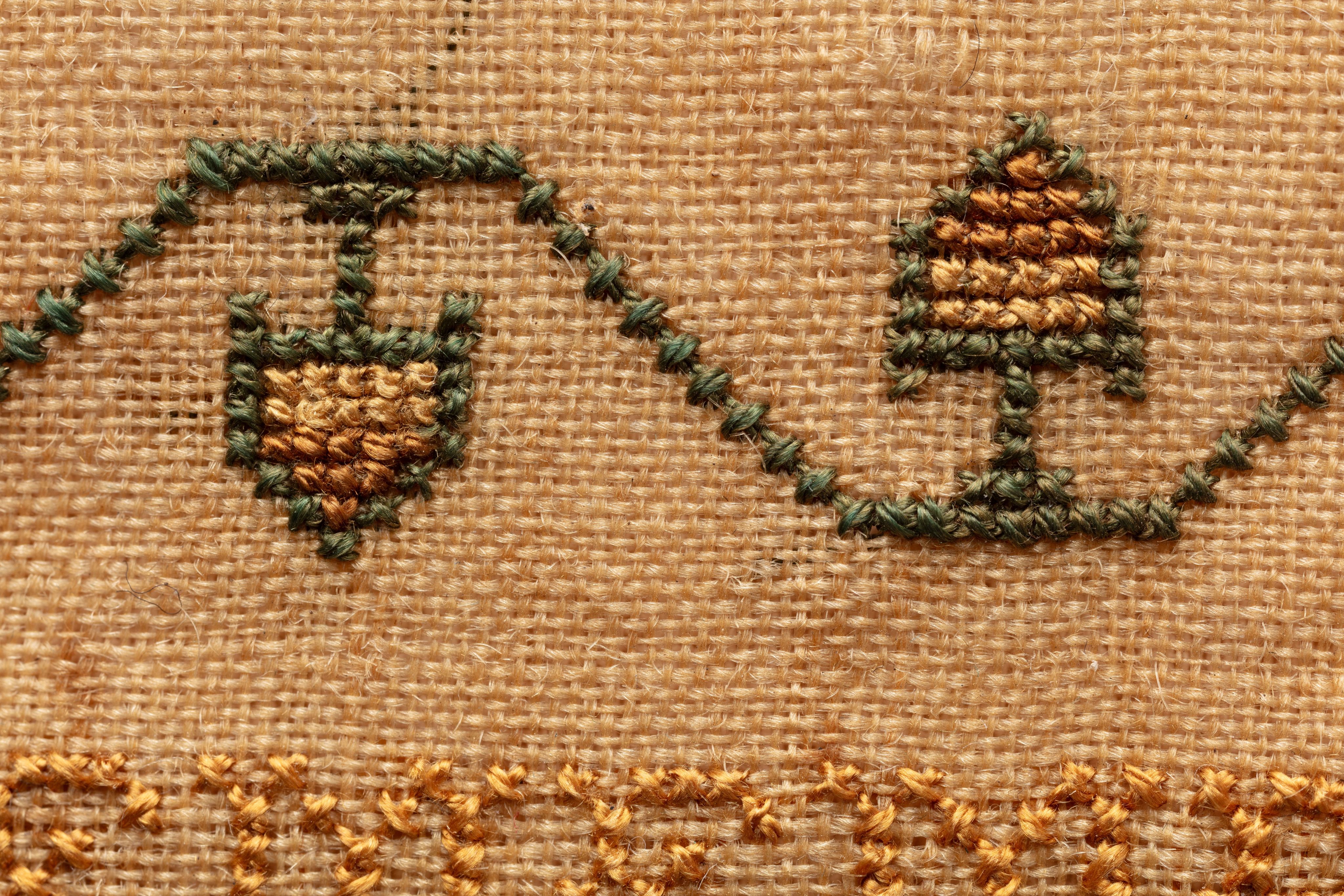fine cloth, finely stitched sampler with texts, alphabets, numerals, and motifs.