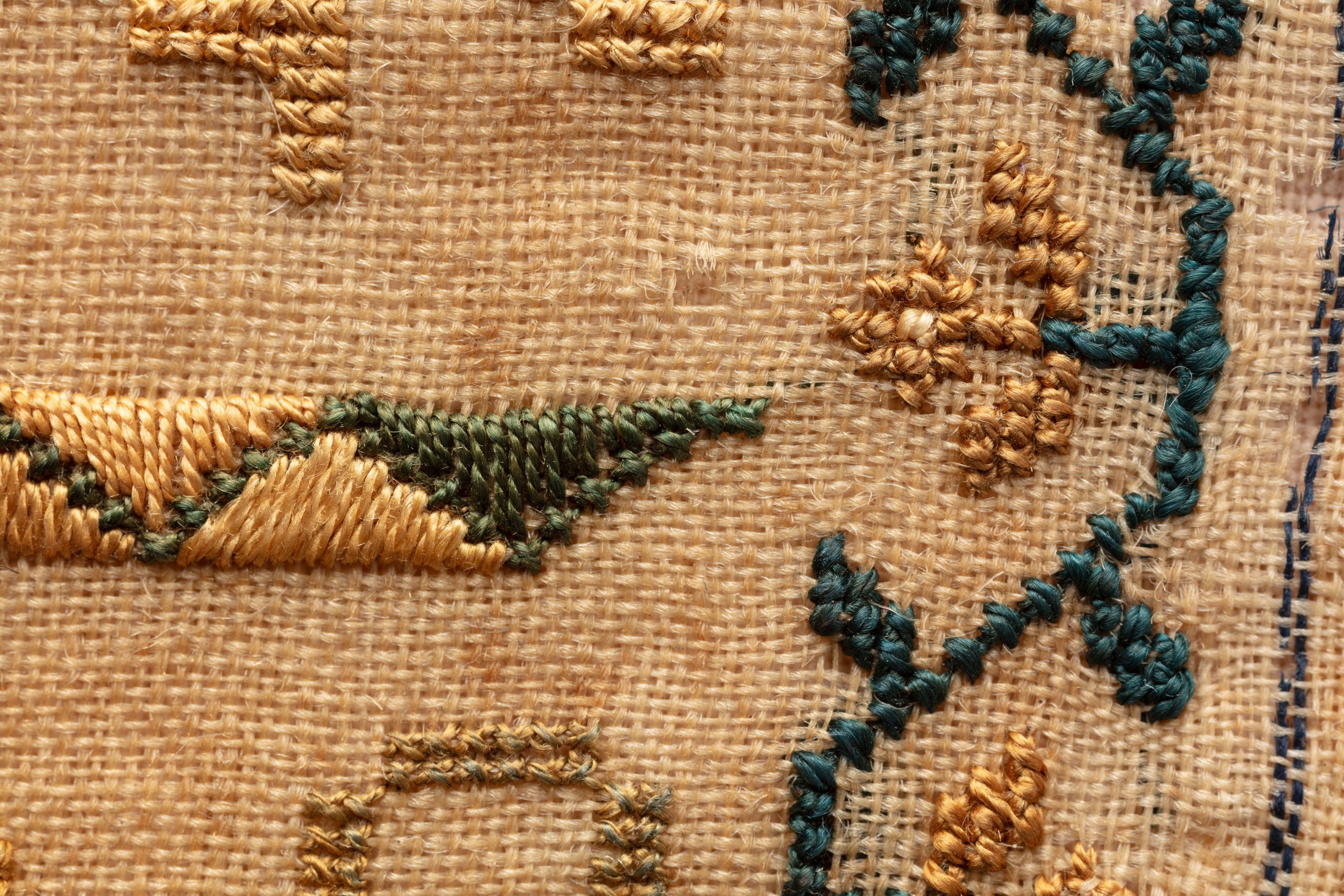 fine cloth, finely stitched sampler with texts, alphabets, numerals, and motifs.