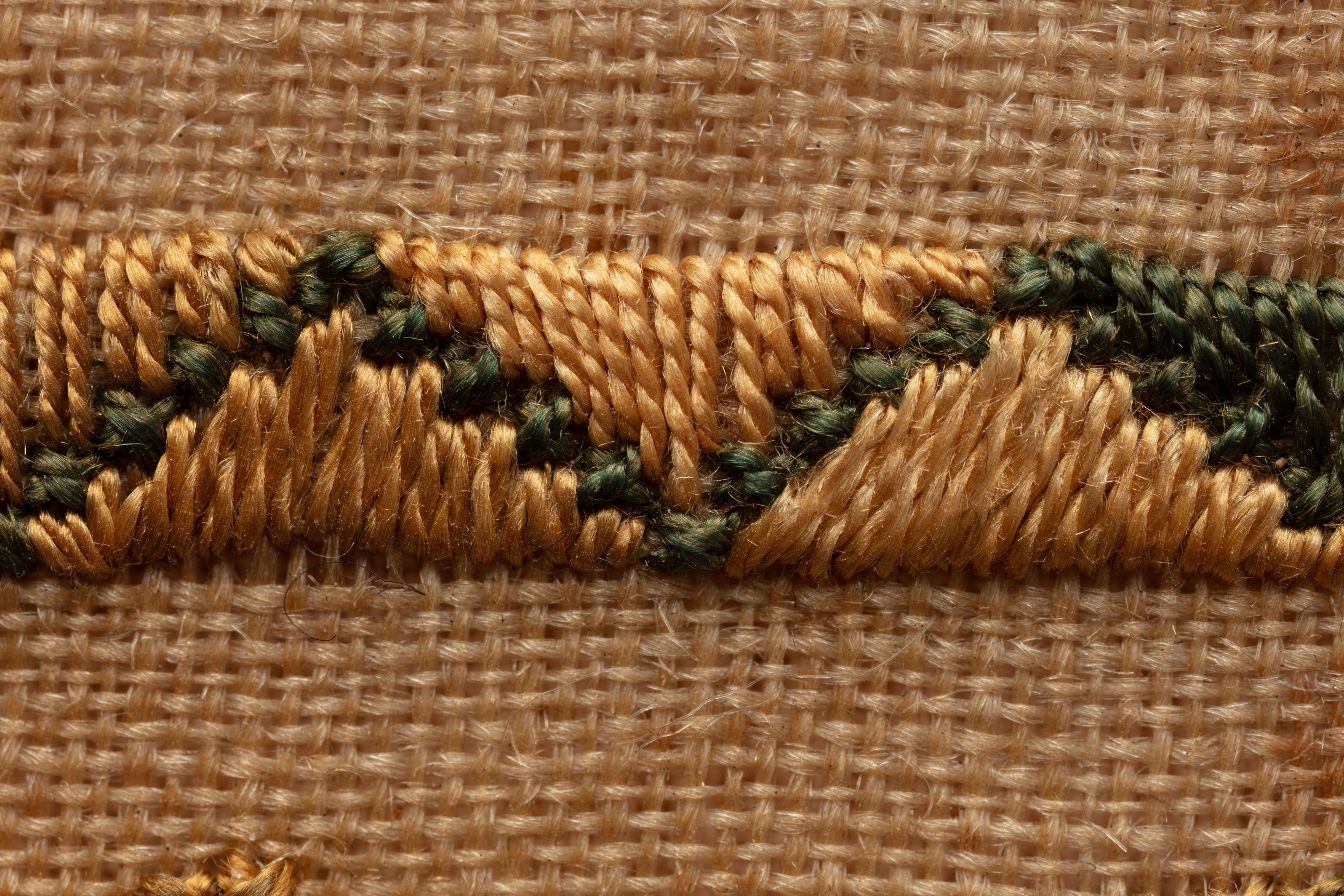 fine cloth, finely stitched sampler with texts, alphabets, numerals, and motifs.