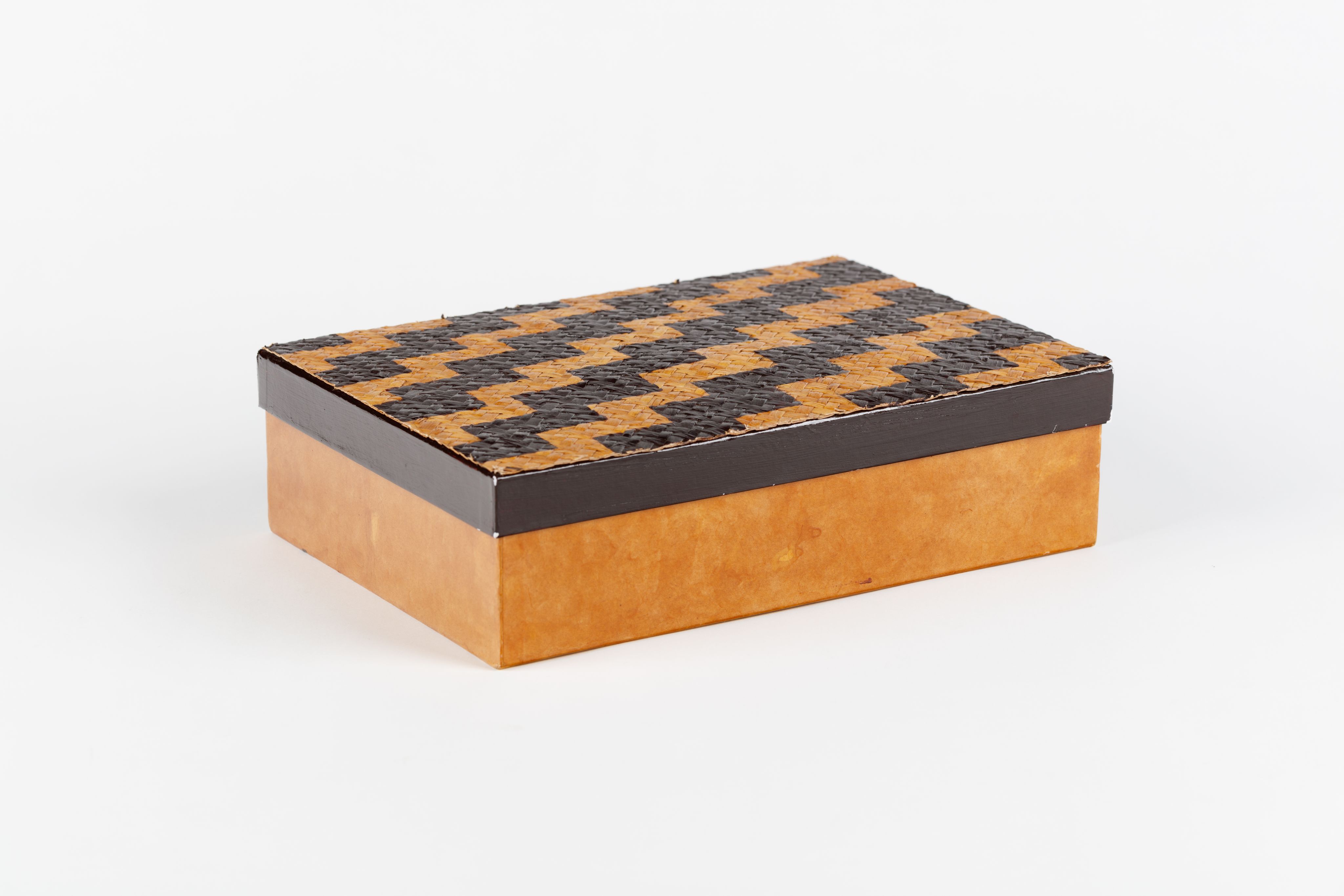  cardboard box with woven lid decorated with poutama (stairway) design