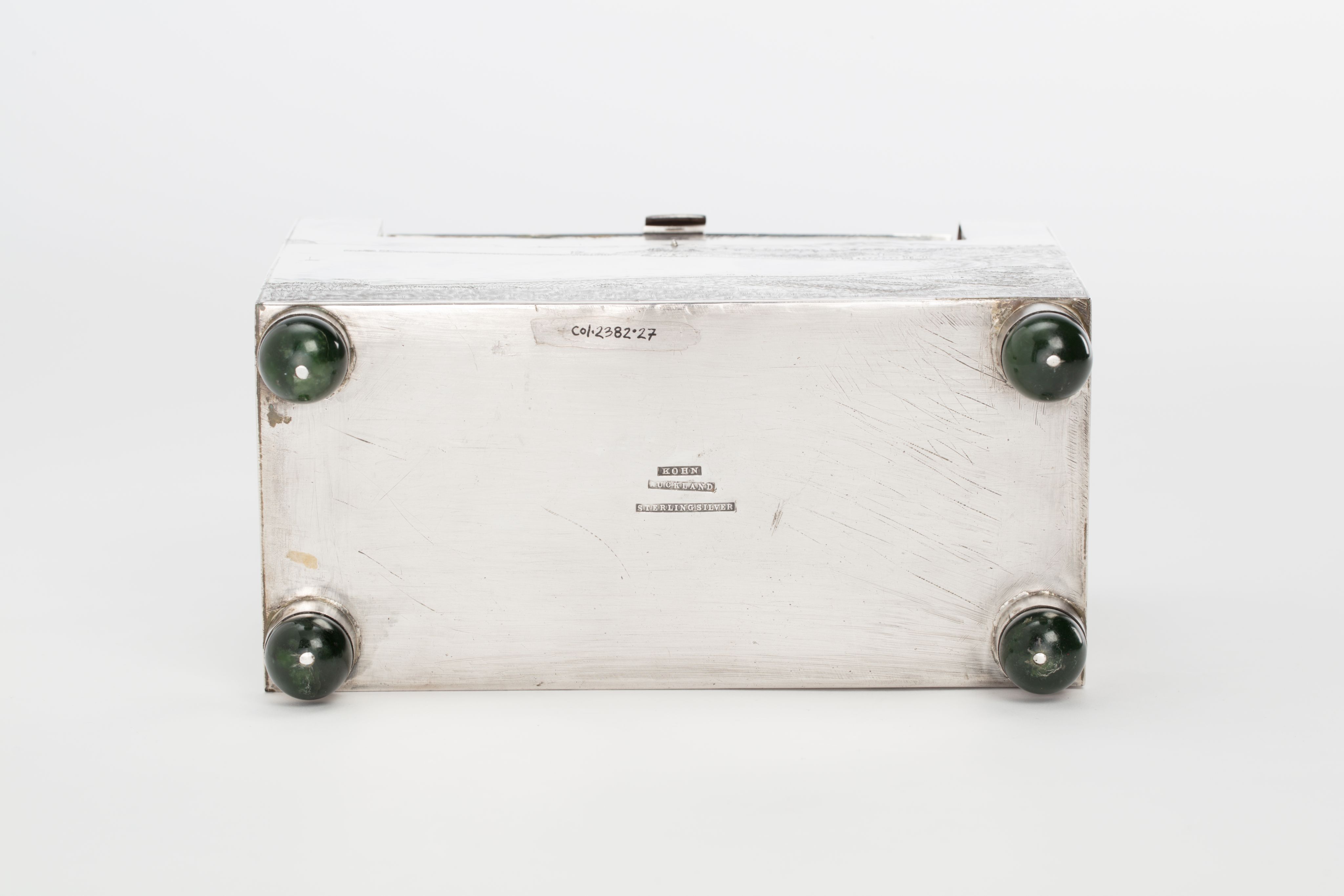 Finely crafted silver box (or casket) designed in the shape of the main sewage pipe, engraved with the names of the members of the drainage board along with technical sewage . On one side there is an engraved illustration of Ōkahu Bay, showing the Ngāti Whātua Ōrākei papakāinga and the newly installed sewer pipe running along the foreshore in front of it.