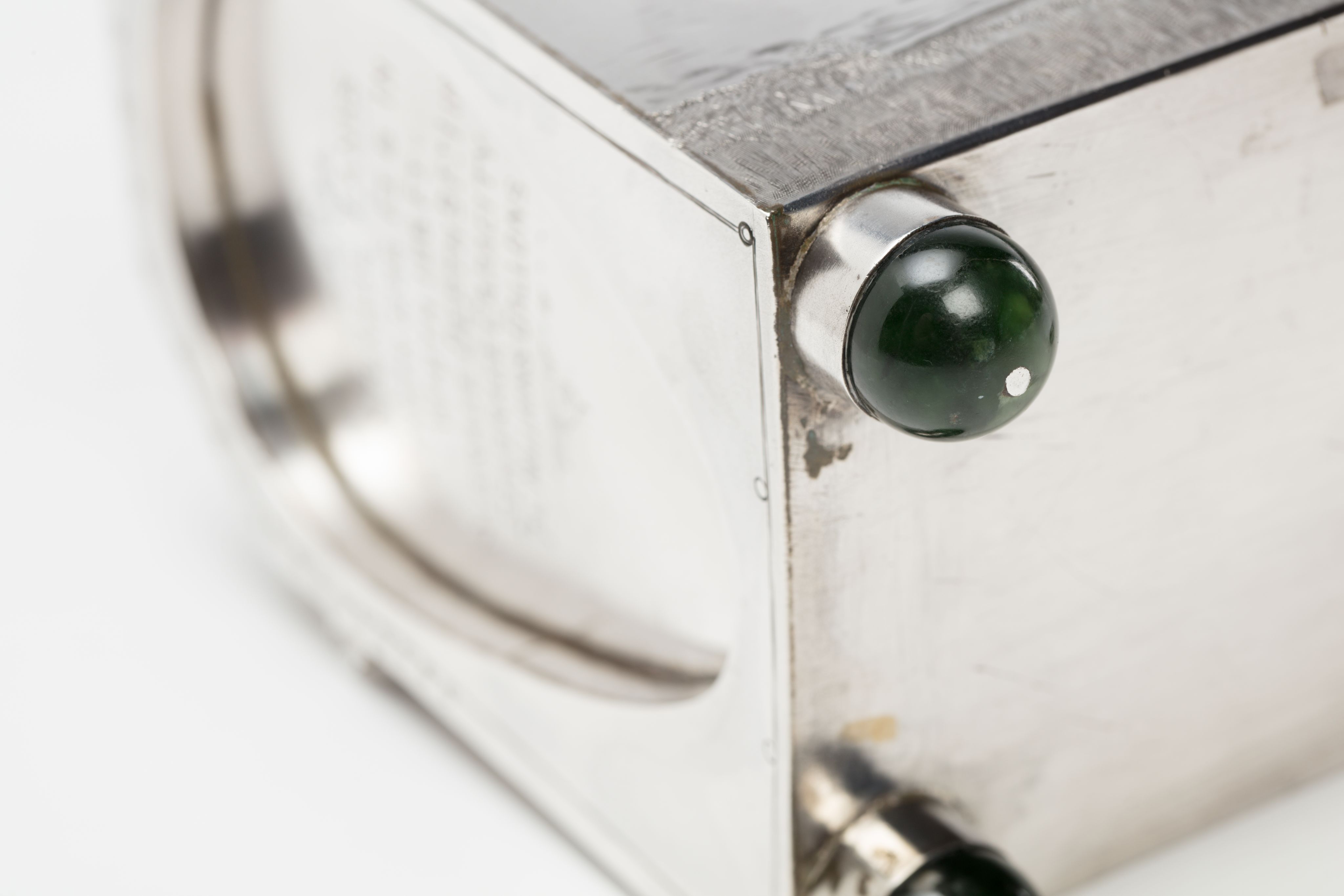 Finely crafted silver box (or casket) designed in the shape of the main sewage pipe, engraved with the names of the members of the drainage board along with technical sewage . On one side there is an engraved illustration of Ōkahu Bay, showing the Ngāti Whātua Ōrākei papakāinga and the newly installed sewer pipe running along the foreshore in front of it.