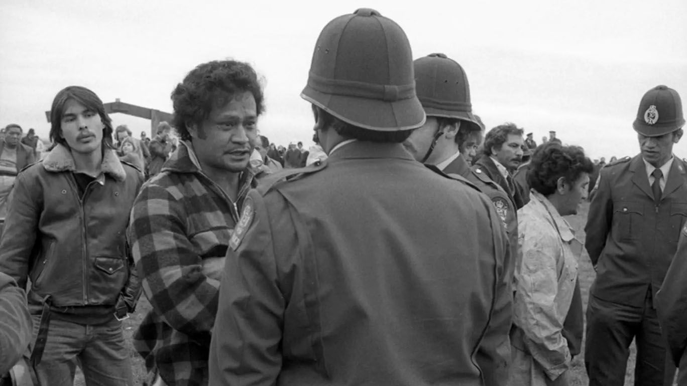 Monochrome photograph of protestors and police during the occupation of Bastion Point.